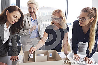 Four businesswomen working in the office Stock Photo