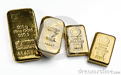 Four a cast gold bars of different weight on white Stock Photo