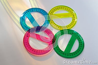 Four colored and round protractors Stock Photo