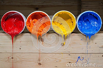 four colors of ink for print tee shirt flowed out of barrel Stock Photo