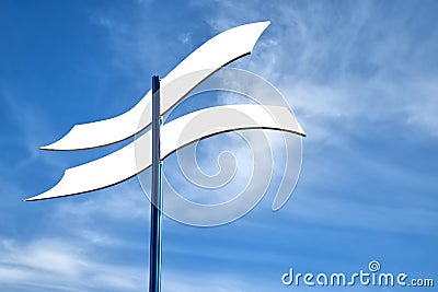 Four curved white direction indicators for lettering against blue sky Stock Photo