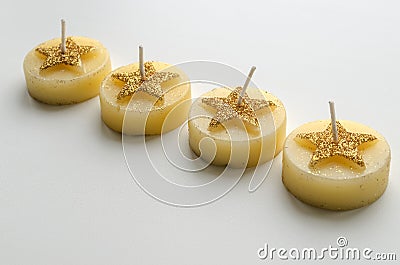 Four decorative candles with star pattern Stock Photo