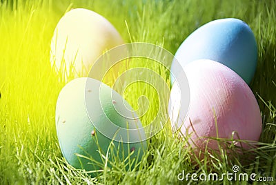 Four Decorative Easter Eggs On Sunny Green Grass Stock Photo