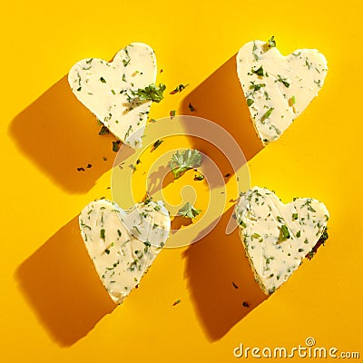 Four decorative heart-shaped butter pats Stock Photo