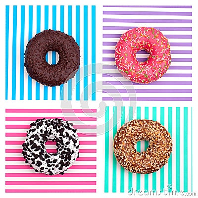 Four different donuts on striped multicolored stripes background top view Stock Photo