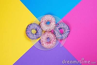 Four donuts on multi colored background Stock Photo