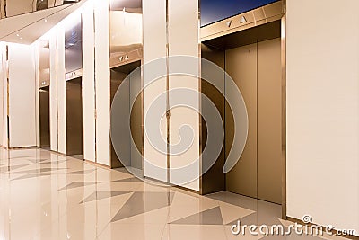 Four elevators in hotel lobby. Stock Photo