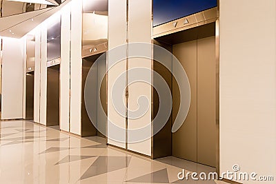 Four elevators in hotel lobby. Stock Photo