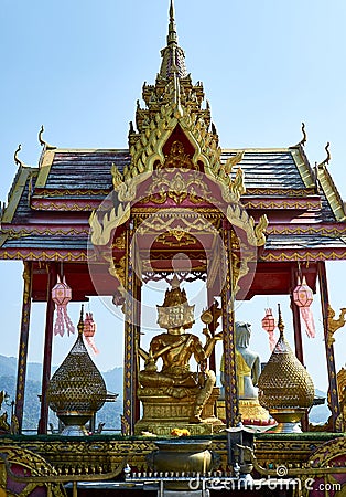Four-faced Buddha Phra Phrom, Brahma statue in front of the Crystal Pagoda Chedi Kaew Wat Tha Ton Stock Photo