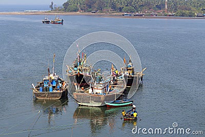 Four fishing boats with sea in a background, Anjarle, Kokan Editorial Stock Photo