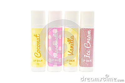 Four flavoured lip balms. Stock Photo