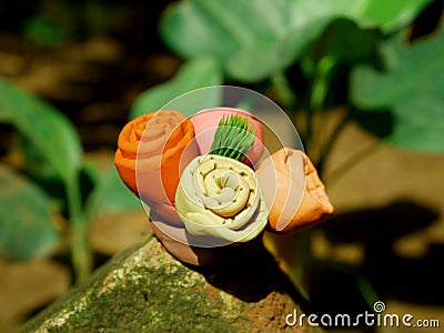 Four flower group with green leaf on center created with soft clay colorful soil material Stock Photo