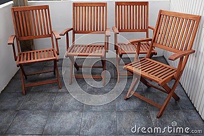 Four folding wooden chairs Stock Photo