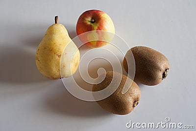 Four fruits with apple pear and two kiwis Stock Photo