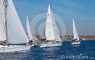 Four fully crewed yachts out sailing Editorial Stock Photo