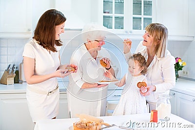 Four generations of women baking apple pie Stock Photo