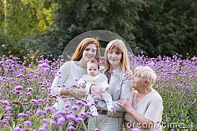 Four generations of women in a beautiful lavender field Stock Photo