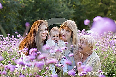 Four generations of women in a beautiful lavender field Stock Photo