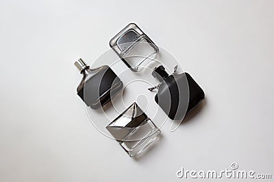 Four glass perfume bottles on white background Stock Photo