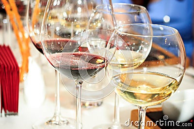 Four glasses of red and white wine Stock Photo