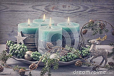 Four green christmas candle Stock Photo