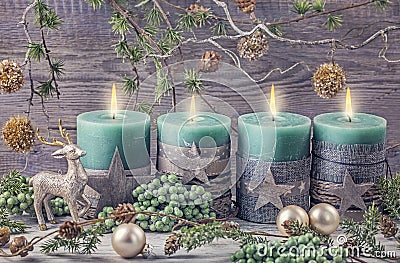 Four green christmas candle Stock Photo