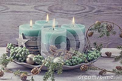 Four green christmas candle Stock Photo