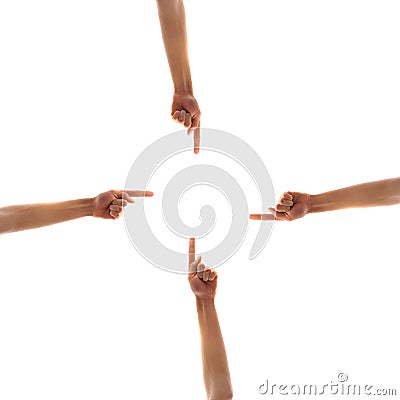 Four hands pointing to center Stock Photo