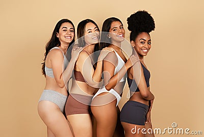 Four smiling diverse women smiling in stylish underwear Stock Photo