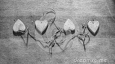 Four hearts linked together with rope Stock Photo