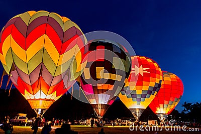 Four hot air balloons are launching at dawn. Editorial Stock Photo