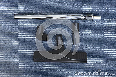 Four kind of attachments for a vacuum cleaner - An extension wand, floor sweeper, crevice tool, and dusting brush Stock Photo