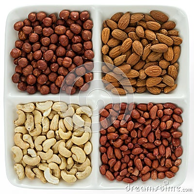 Four kinds of nuts in four compartments of combination plate Stock Photo