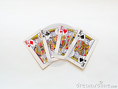 Four kings from a deck of playing cards isolated on a white background. Pik, club, diamond and heart suit Stock Photo