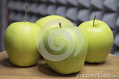 Four large apples, close-up. Fruit on a wooden surface Stock Photo