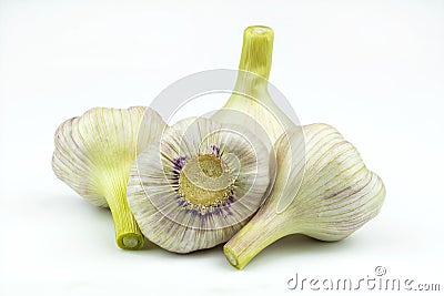 Four large heads of garlic isolated on a white background Stock Photo