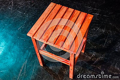 four legged wooden step stool over black Stock Photo