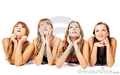 Four lovely girls laying on the floor together Stock Photo