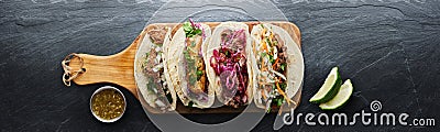 Four mexican street tacos with fish barbacoa and carnitas Stock Photo