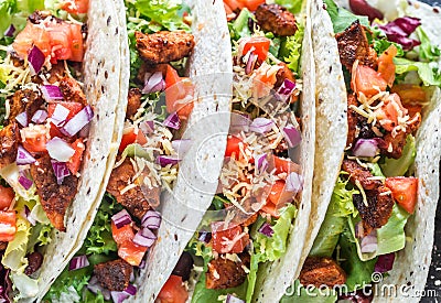 Four mexican tacos on a black background Stock Photo