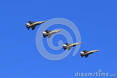 Four MiG-31BM in flight on background blue sky Editorial Stock Photo