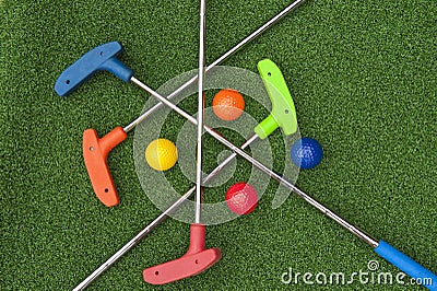 Four Mini Golf Putters and Balls Stock Photo