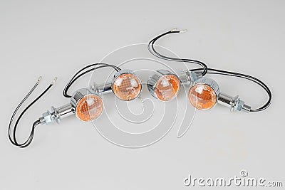 Four modern led turn signal flashing new chrome motorcycle in an old retro style motorbike Stock Photo