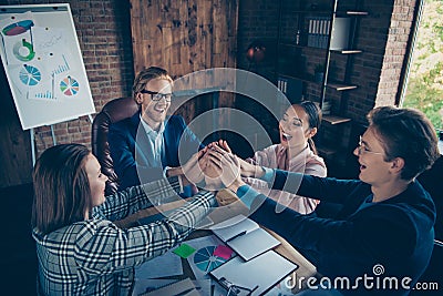 Four nice chic elegant stylish cheerful glad ecstatic business sharks experts gathering appointment putting hands over Stock Photo