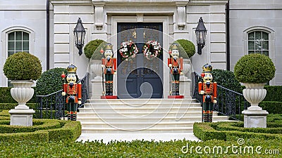 Four Nutcrackers guarding the door of a mansion in Highland Park at Christmas in Dallas County, Texas Editorial Stock Photo