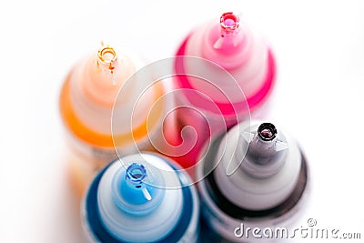 Four open printer bottles with CMYK colour ink Stock Photo