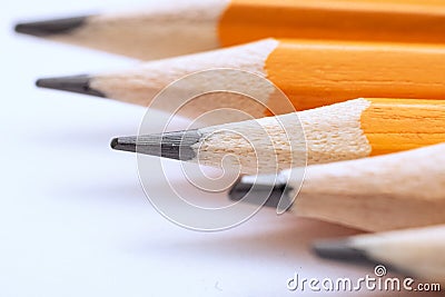 Four pencils on white background, macro photo Stock Photo