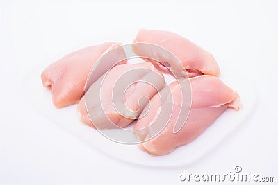 Four pieces of raw chicken on a white plate, AI Stock Photo