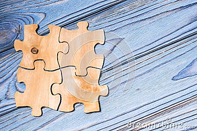 Four pieces of wooden puzzles Stock Photo