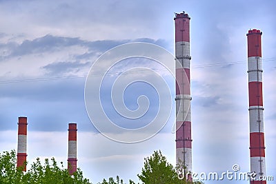 four pipes heat station against the blue sky color Stock Photo